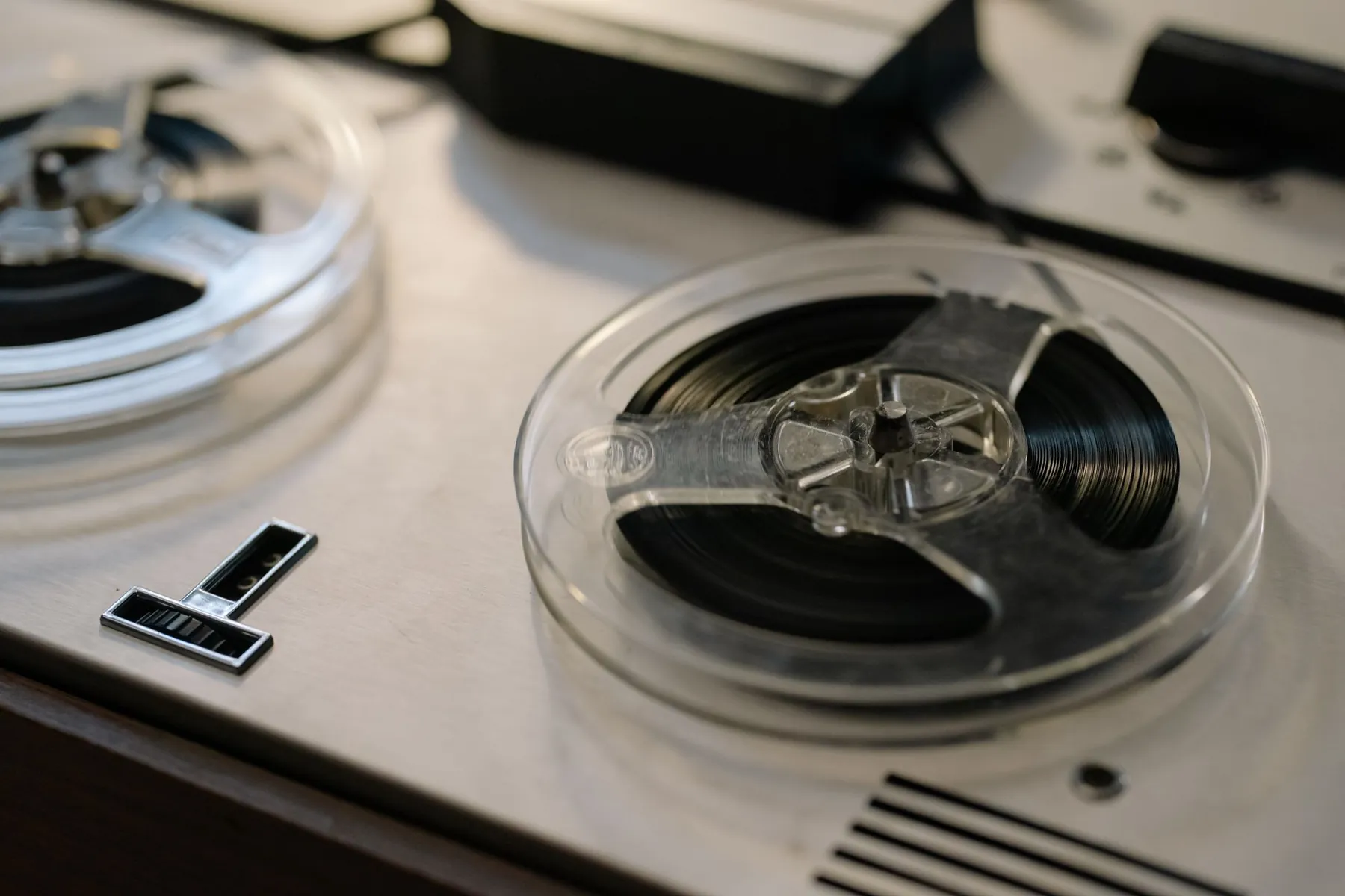 Tape reels on a vintage reel-to-reel recorder.